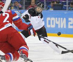 Japan defense Suzuki fires shot in women's ice hockey prelim