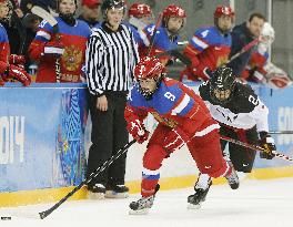 Koike chases Russian player in women's hockey at Sochi
