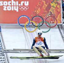 Japan Nordic combined skier A. Watabe prepares to jump