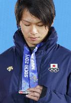 Japan's Hirano receives his silver medal