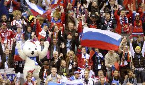 Russian spectators cheer as Russia scores in ice hockey game