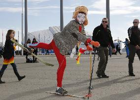 Street performer walks in Sochi Olympic Park in sunshine