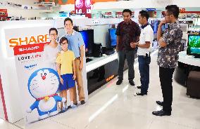 Sharp's ad panel with Doraemon at Indonesia store