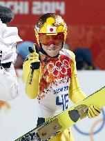 Japan's Kasai poses for cameras after 1st jump on large hill