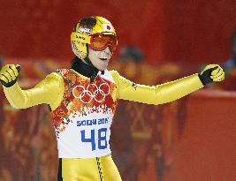 Japan's Kasai pumps fists after 2nd jump on large hill