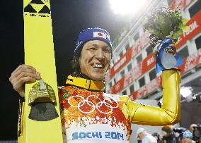 Japan's Kasai beams after winning silver in large hill jump