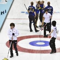 Japan players leave ice after curling loss to Sweden in Sochi