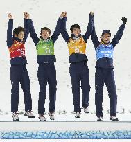 Japan's ski jump team members rejoice during flower ceremony