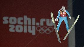 Japan's Shimizu competes in team ski jumping in Sochi