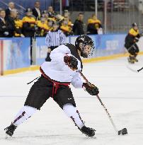 Japan's Koike attempts goal in women's ice hockey
