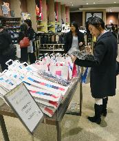 Department stores aim to lure foreigners ahead of sales tax hike