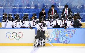Japan players listen to coach in women's ice hockey game