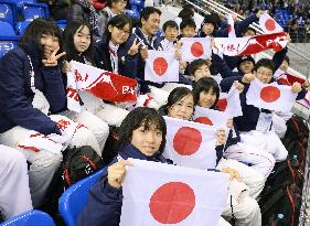 Students from Japan's disaster-hit areas cheer for ice hockey team