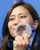 Japan's snowboarder Takeuchi kisses silver medal