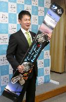 Hiroshima gov. shows off snowboard from Sochi medalist Takeuchi