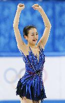 Japan's Asada smiles after hailed performance at Sochi