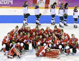 Canadian team after winning women's ice hockey gold
