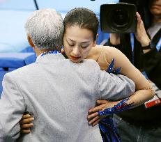 Asada hugs coach after free program at Sochi