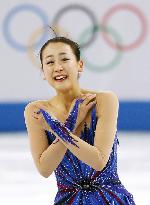 Japan's Asada smiles through tears after free program