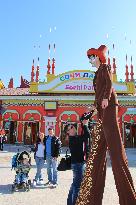 People enjoy attractions at theme park being built in Sochi