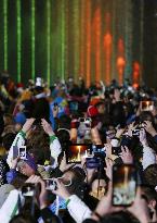 Visitors shoot Olympic torch, fountains in Sochi