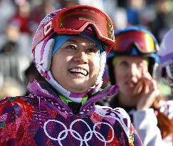 Japan's Takeuchi smiles after women's snowboard slalom prelim