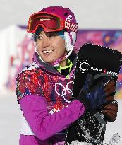 Japan's Takeuchi smiles after women's snowboard slalom prelim