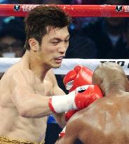 Japnese boxer Murata punches opponent in fight in Macao