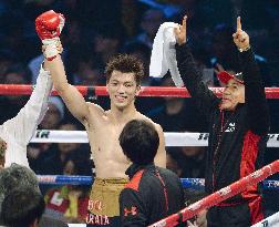 Japanese boxer Murata smiles after winning fight in Macao