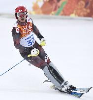 Japan's Sasaki competes in men's skiing slalom in Sochi