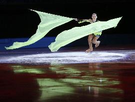 Gold medalist Sotnikova carries flags at exhibition gala