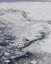 Cruise ships navigate through drift ice off Hokkaido