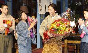 Actress Anne receives flowers after end of shooting TV drama