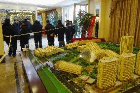 Guards on alert at condo model room in China