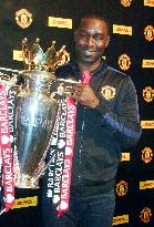 Cole holds Premier League's winning trophy