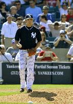 Yankees' Japanese rookie pitcher Tanaka makes solid debut
