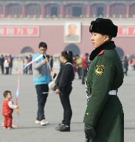 Armed police officer stands guard at Tiananmen Square