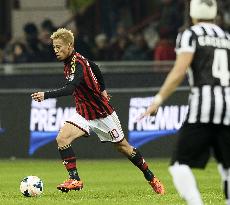 Milan's Japanese midfielder Honda in action against Juventus
