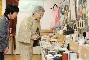 Empress visits exhibition of craftwork of mentally disabled