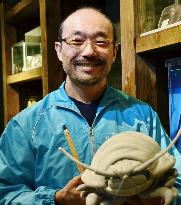 Aquarium keeper in Mie studying giant isopods