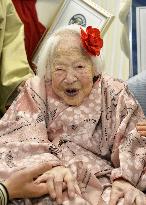 World's oldest person smiles before 116th birthday