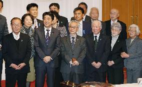 PM Abe meets kin of Japanese abducted by N. Korea