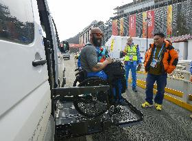 Greek athlete lifted onto vehicle at Sochi Paralympics