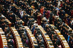 China's parliament pays tribute to victims of killing spree