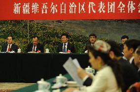 Xinjiang Uyghur delegates meet during China's parliament session