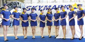 Skymark flight attendants with miniskirt uniforms