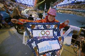 Woman shows patchwork before Paralympic opening ceremony