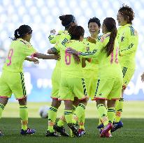 Japan players celebrate Ogimi's equalizer