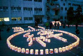 Kanji for 'kizuna' formed with candle lanterns