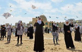 Children in Gaza fly kites for 2011 disaster survivors
